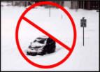 Image of car parked in snow, with a red circle with a slash through it